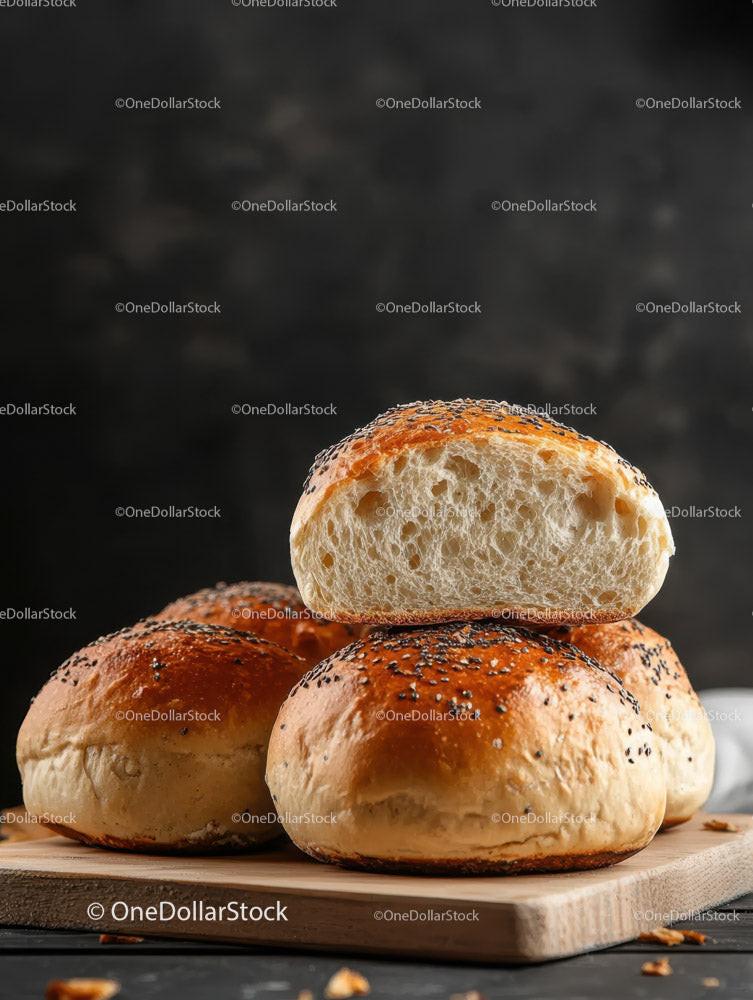 Fresh Baked Sesame Seed Bread Rolls on Wooden Board