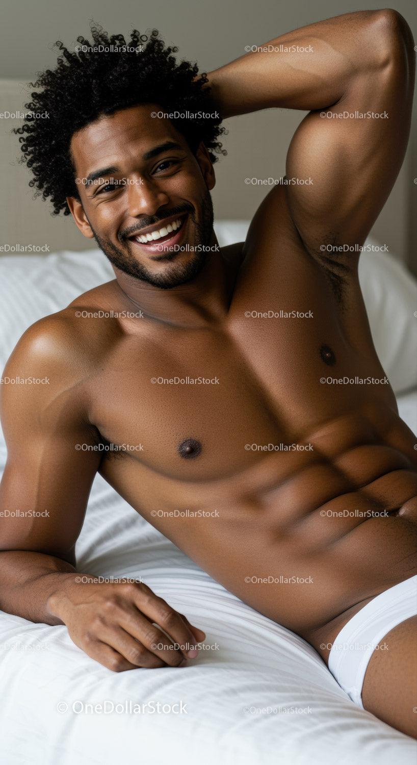 Smiling man relaxing on bed in bright room