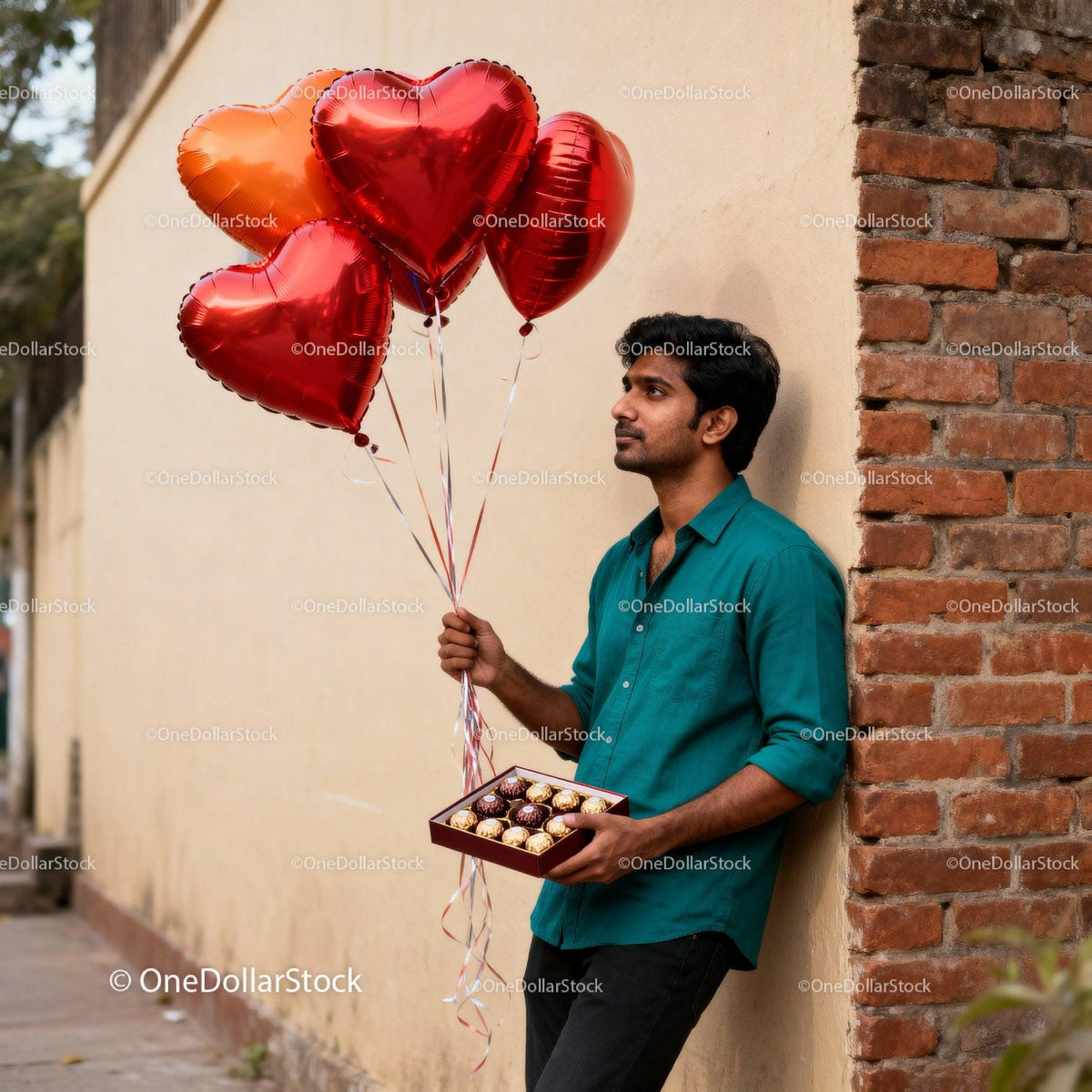 Man Holding Heart Balloons and Chocolates for Valentine