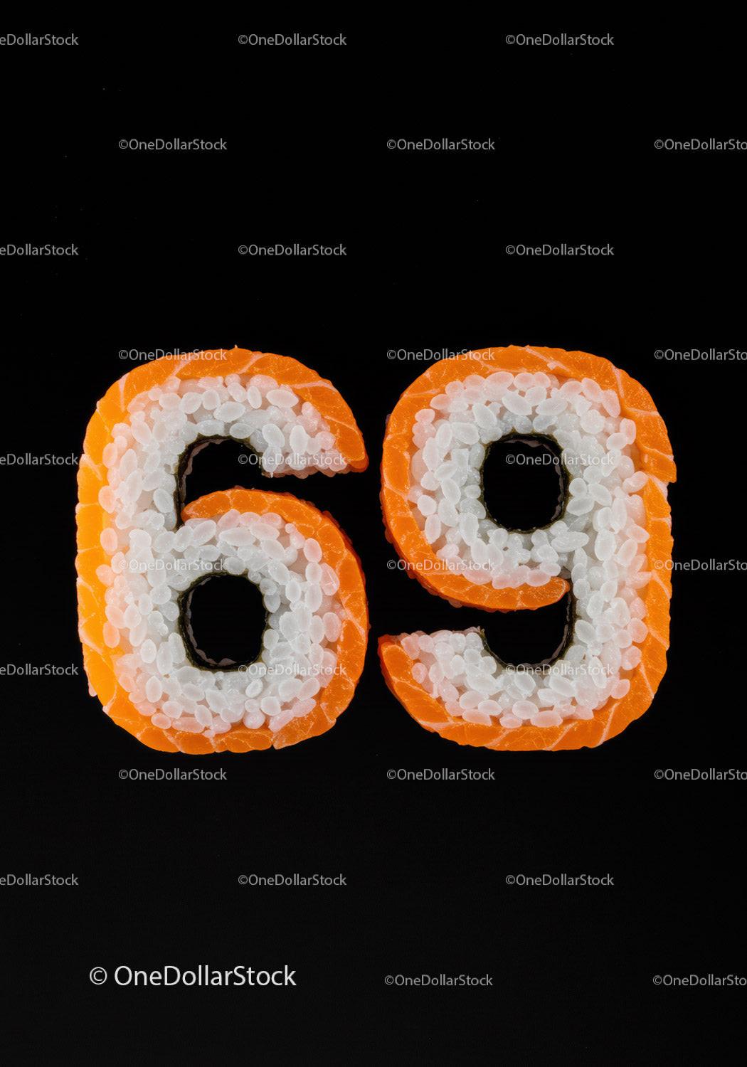 Sushi Rolls Shaped as Number Sixty Nine on Black