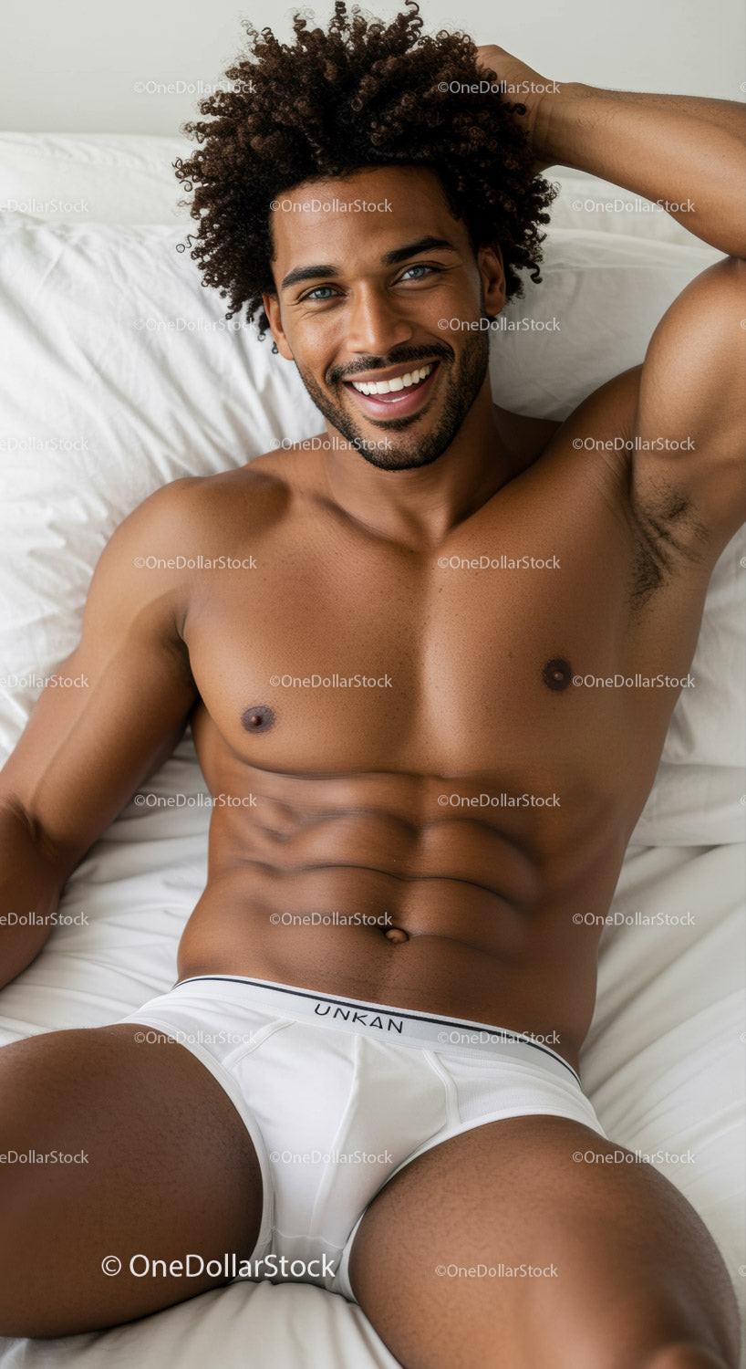 Handsome man relaxing comfortably on white bedding