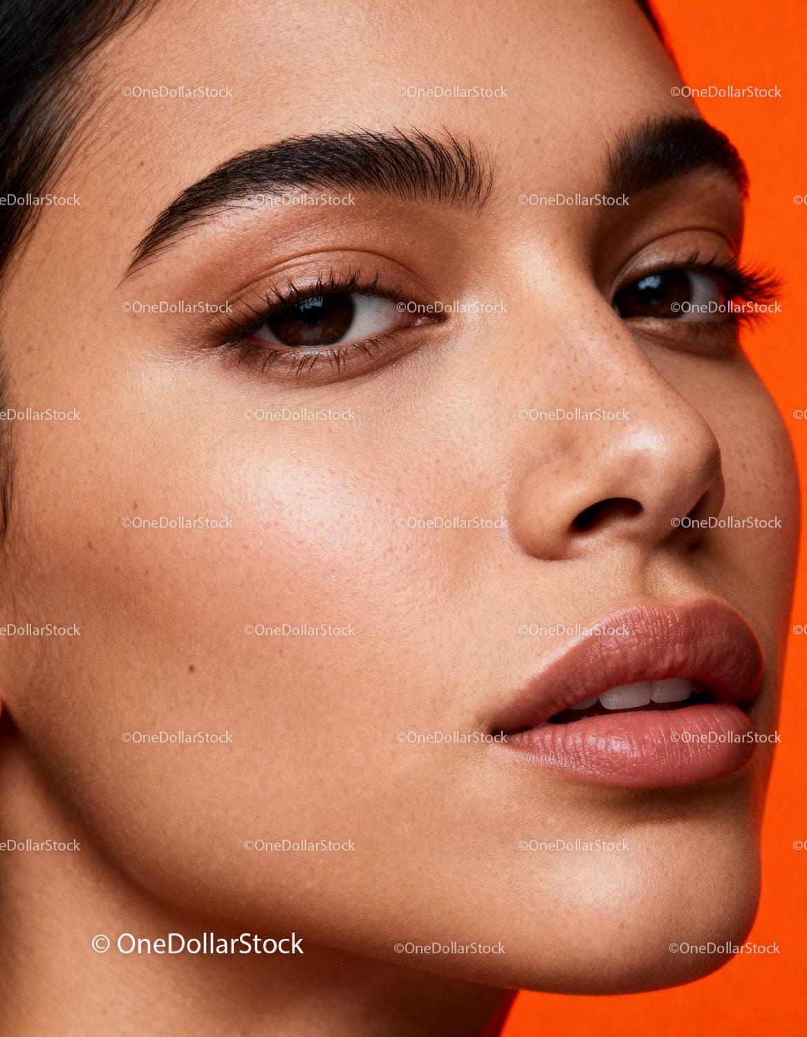 Close-up of natural glowing skin with defined eyebrows