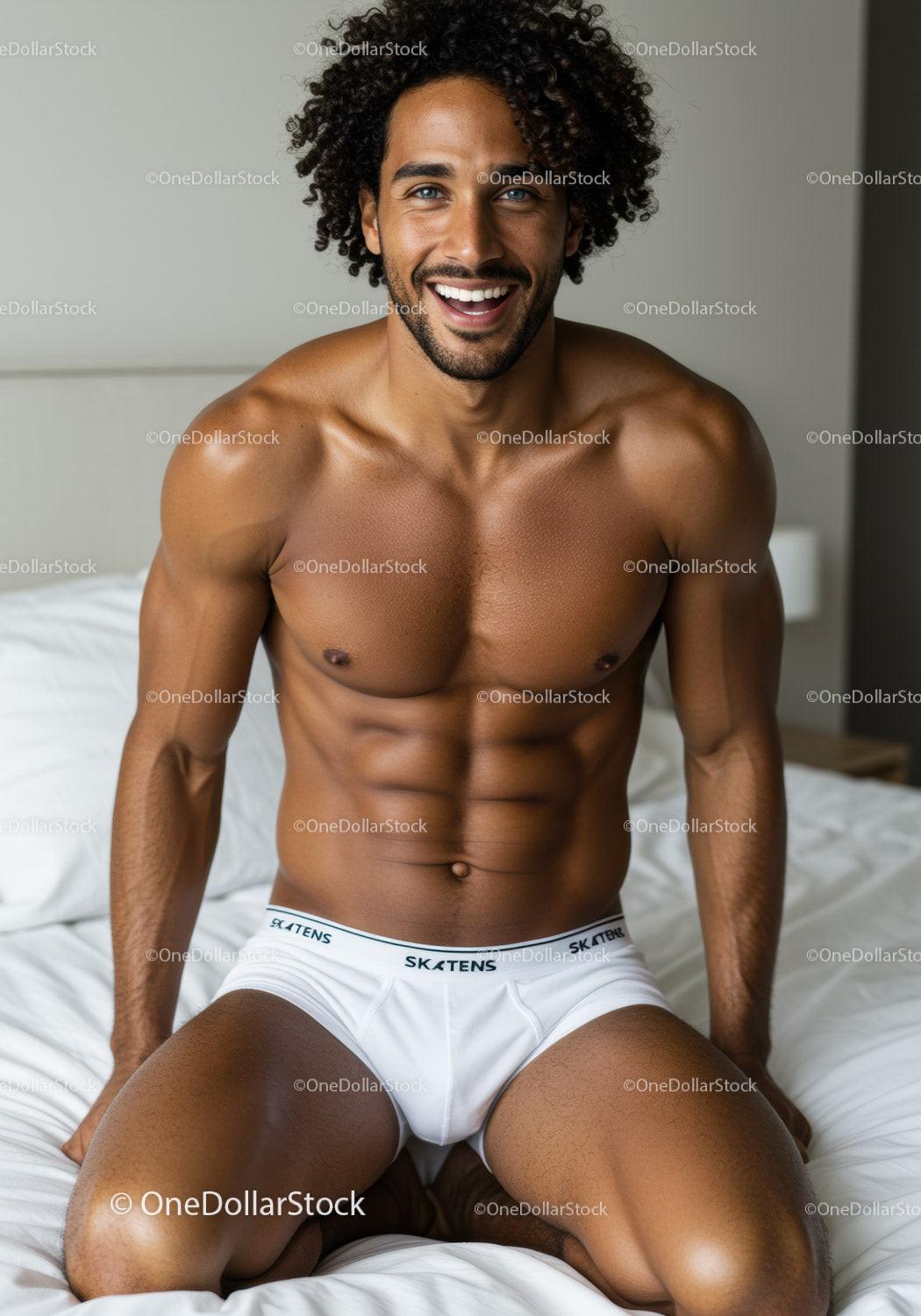 Smiling muscular man sitting on bed in white underwear