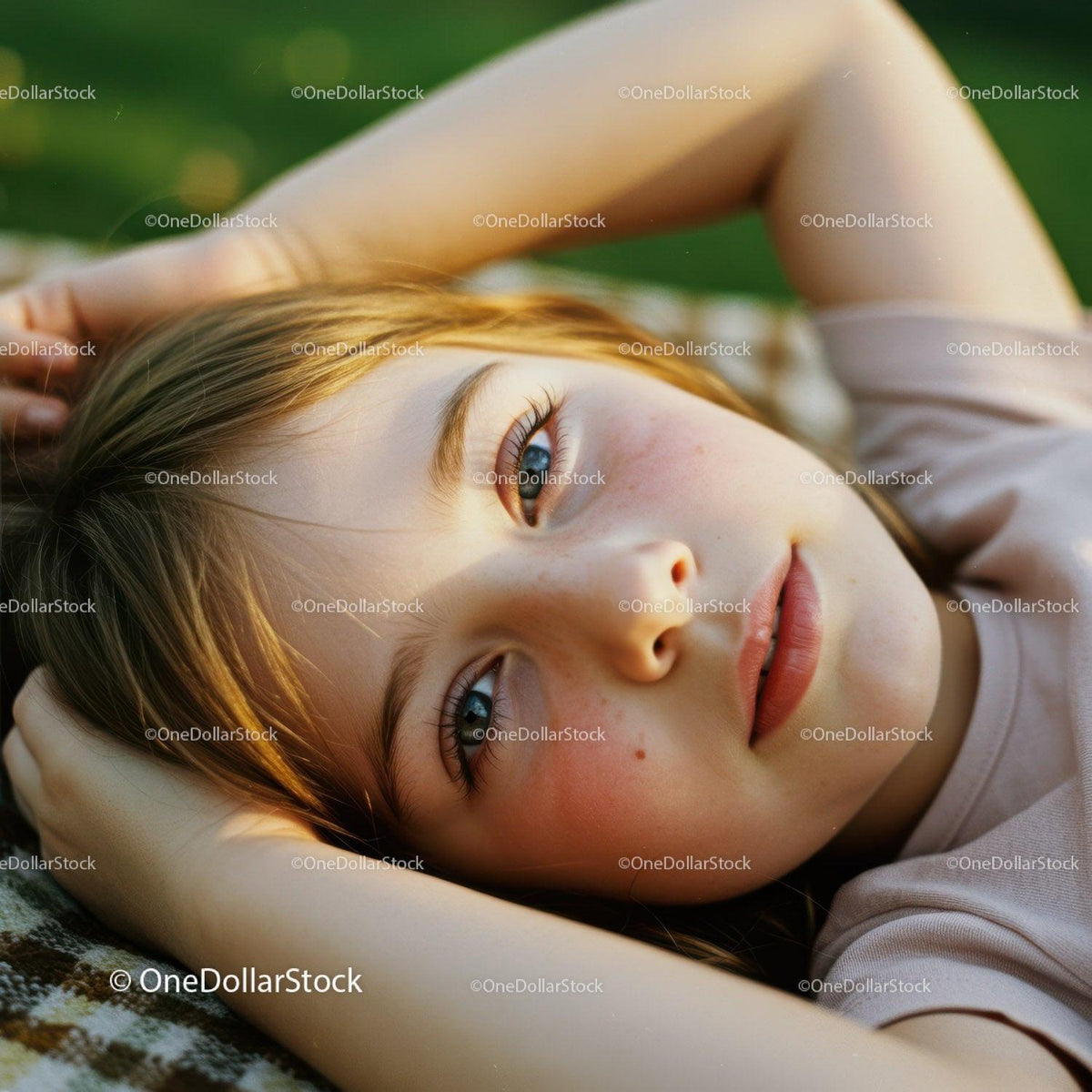 Close-up of thoughtful young woman lying outdoors