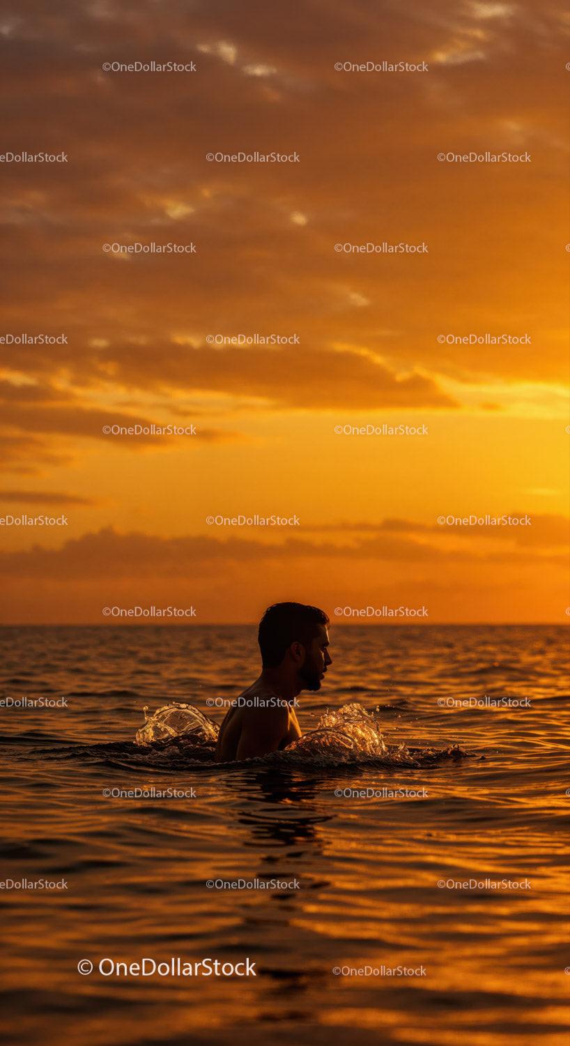 Serene Man Swimming in Ocean During Vibrant Sunset Stock Photo Bundle preview 12
