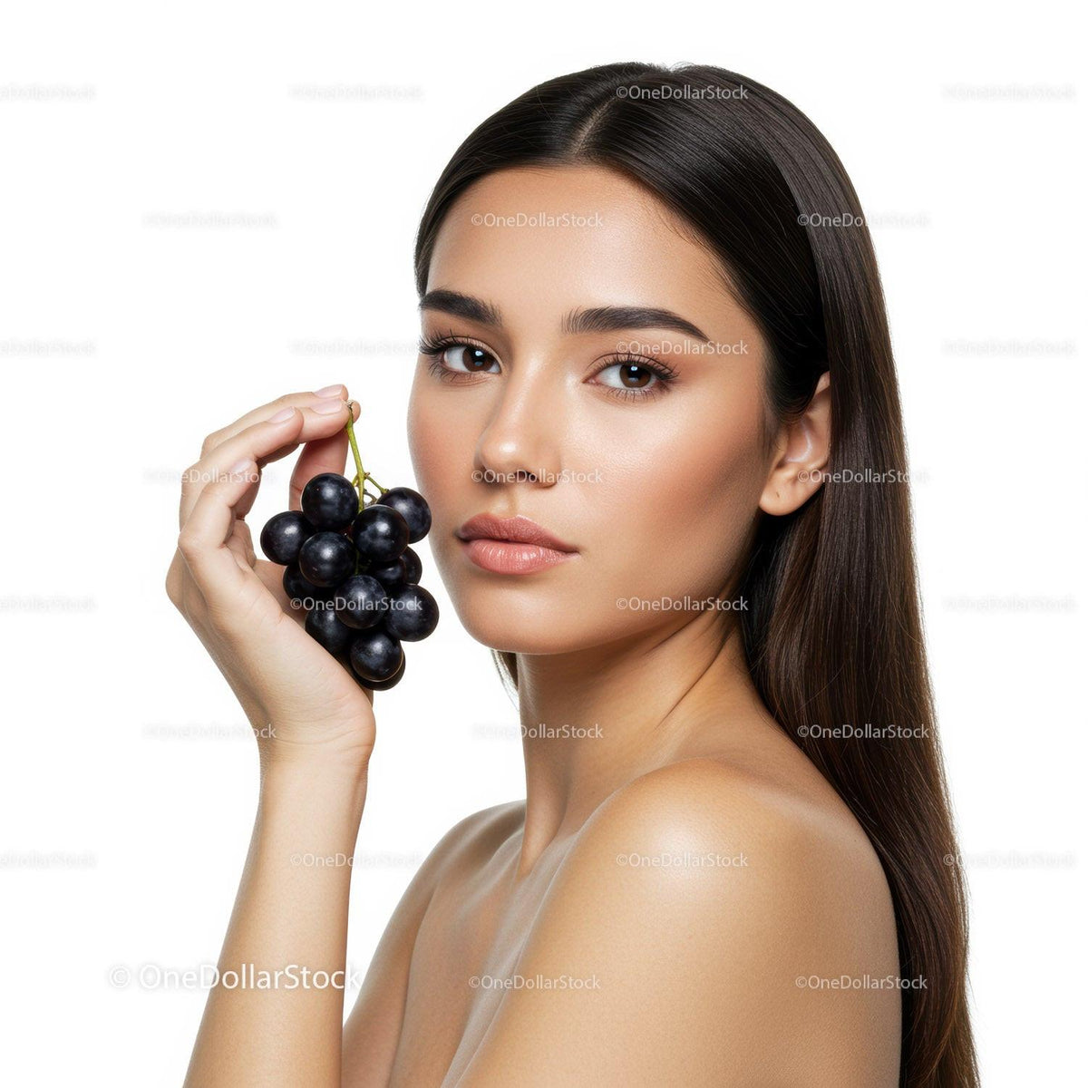 Elegant Portrait of Woman Holding Fresh Black Grapes with Flawless Skin