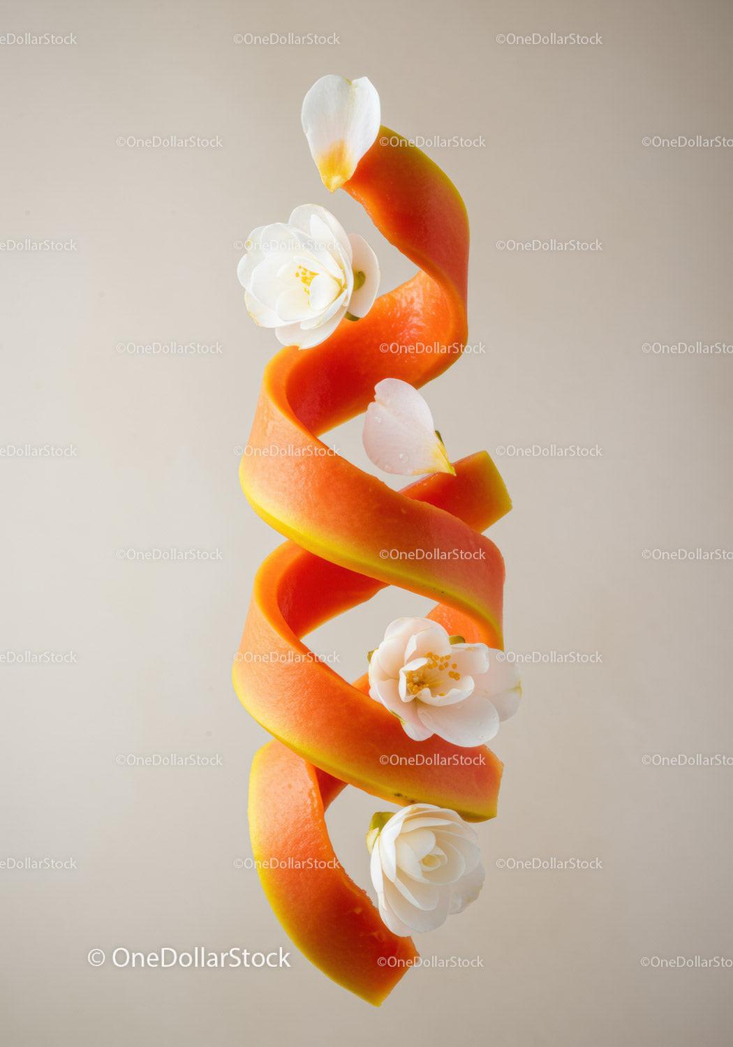 Spiral papaya peel decorated with white flowers