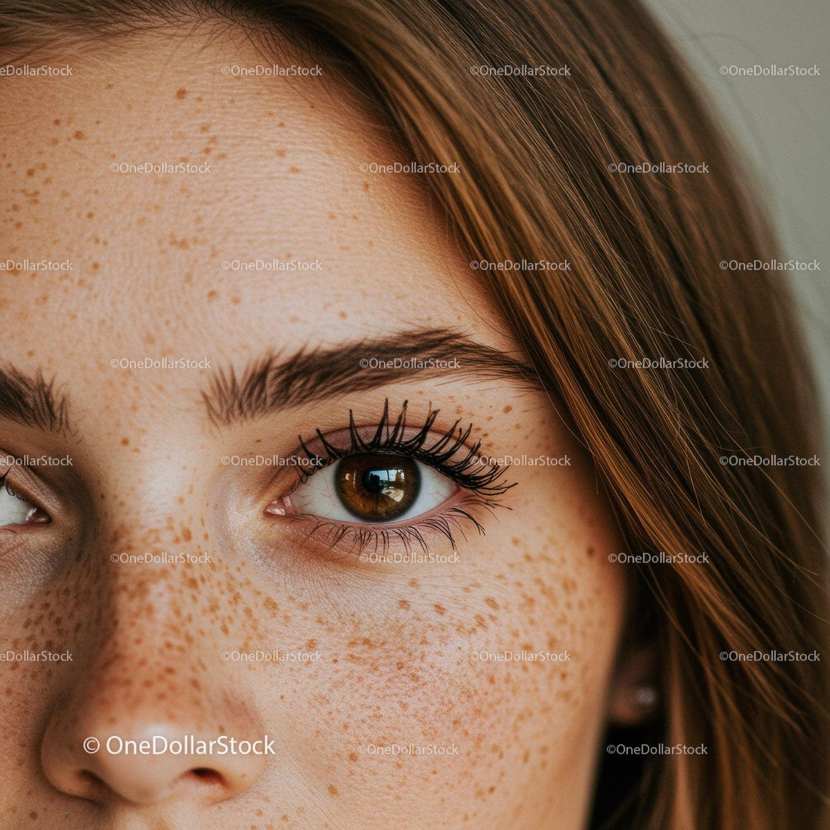 Close-Up of a Freckled Woman with Vibrant Brown Eyes and Long Lashes