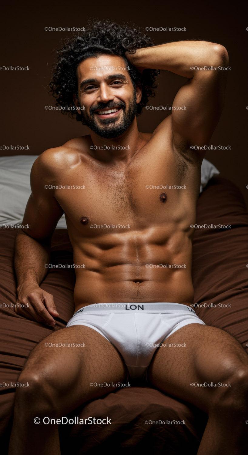 Smiling muscular man relaxing on brown bedding in white briefs