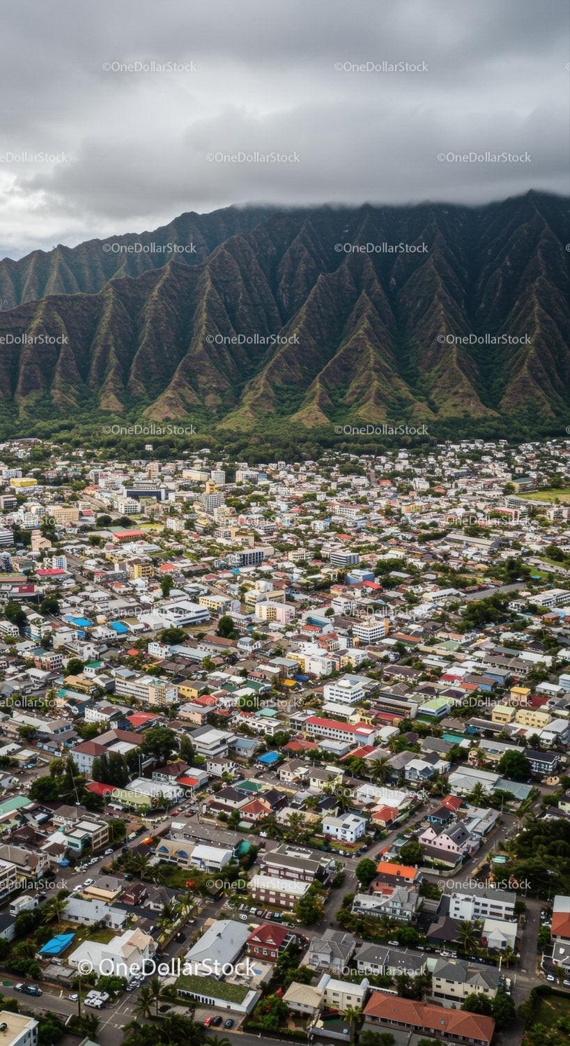 Urban Residential Area with Mountain Background Under Cloudy Sky