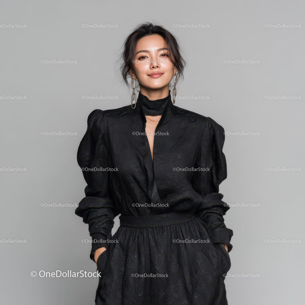 Elegant Woman in Black Dress with Jewelry in Studio Portrait