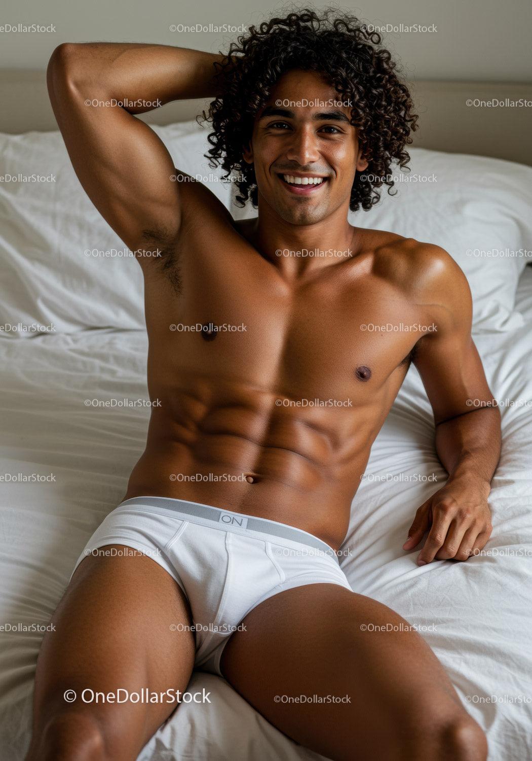 Smiling young man relaxing on white bed in underwear