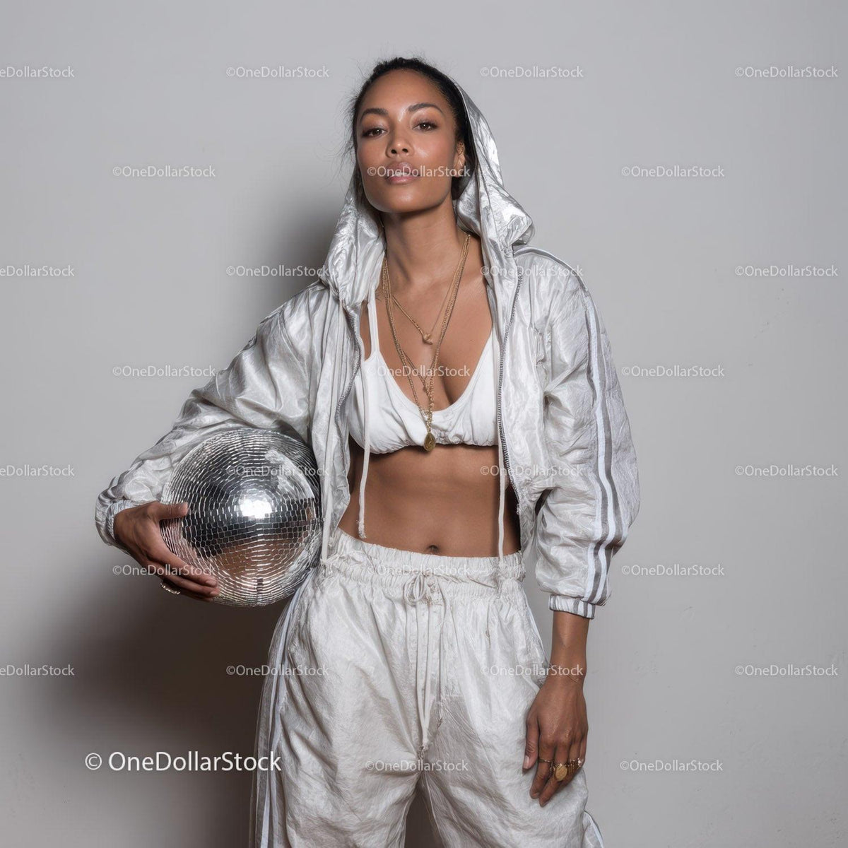 Stylish Woman in Metallic Outfit Holding Disco Ball for Modern Fashion Stock Photo Bundle preview 15