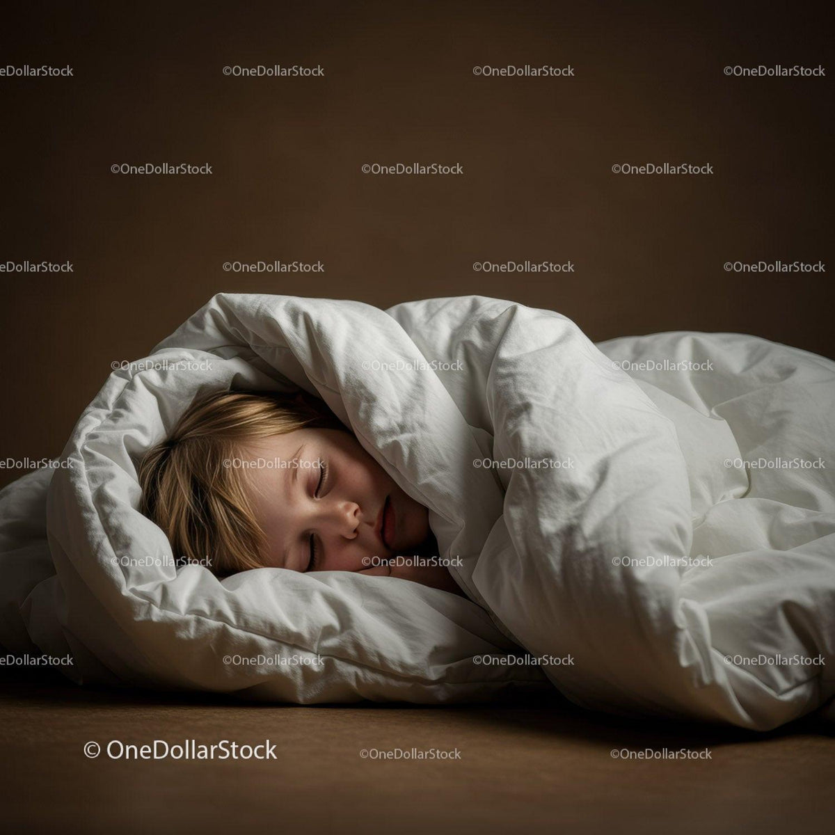 Peaceful child sleeping wrapped in cozy white blanket
