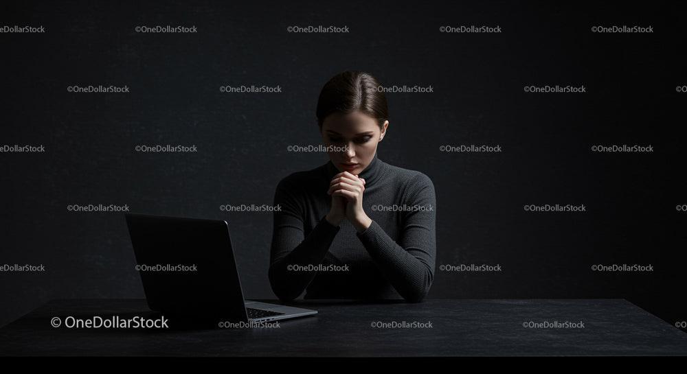 Pensive Woman Contemplating at Desk with Laptop