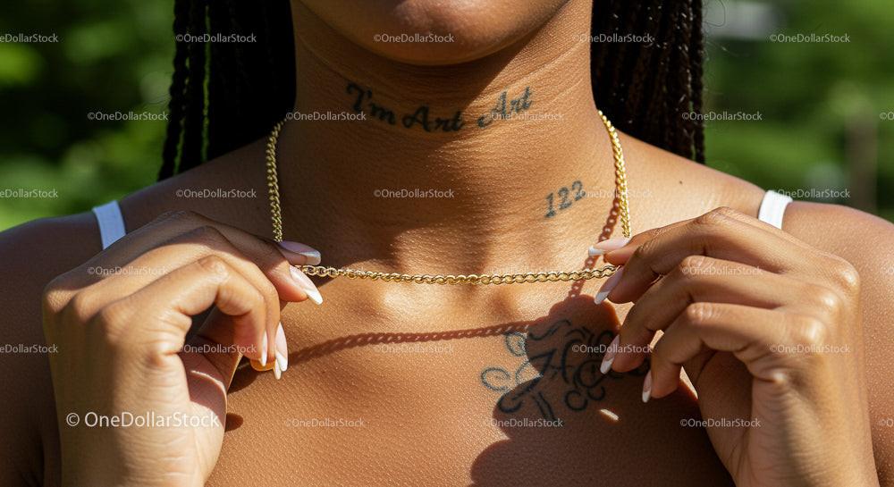 Stylish Woman Wearing Gold Necklace and Tattoos