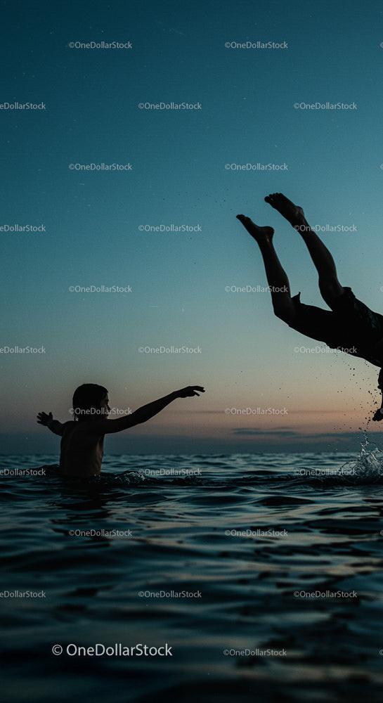 Playful Swim at Sunset with Vibrant Ocean Waves