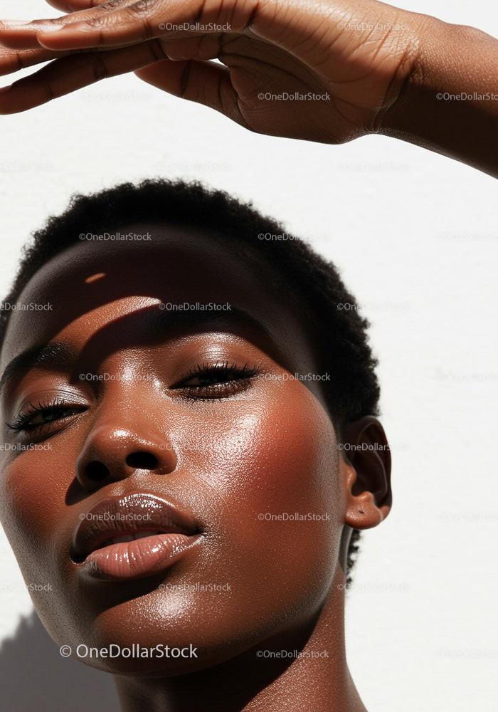 Serene Woman with Radiant Skin in Sunlit Portrait