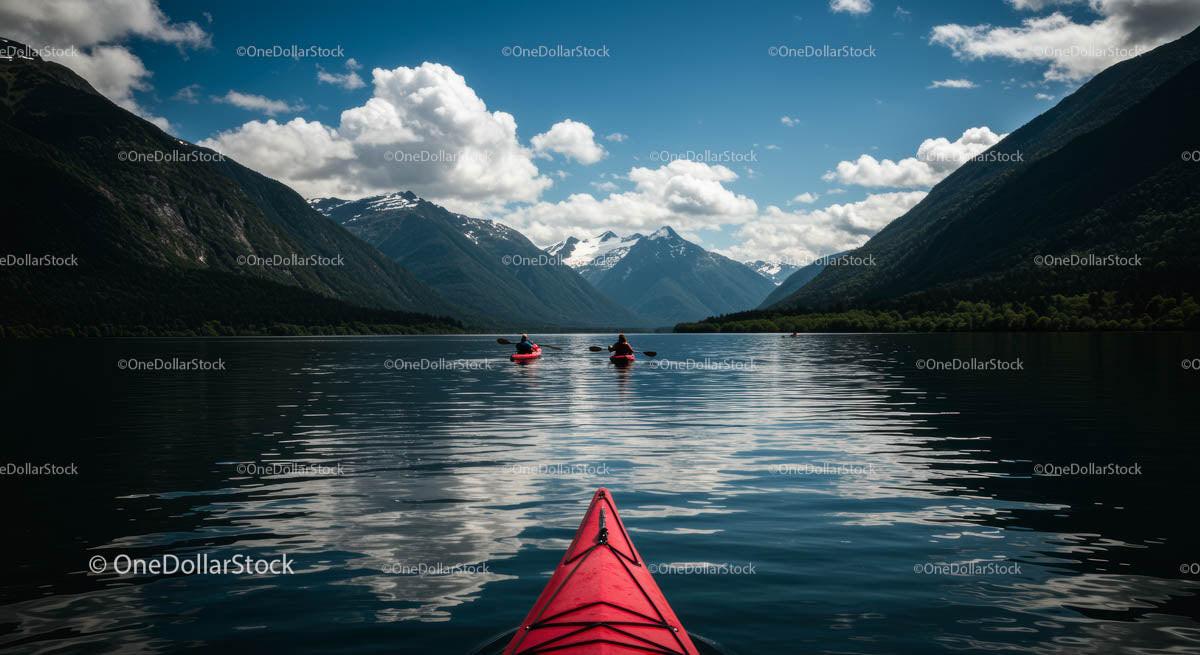 Kayaking on Tranquil Mountain Lake with Snowy Peaks