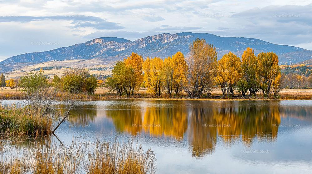 Autumn Reflections in Tranquil Lake with Mountain Backdrop