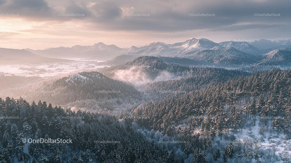 Snow-Covered Mountains and Misty Forest at Sunrise