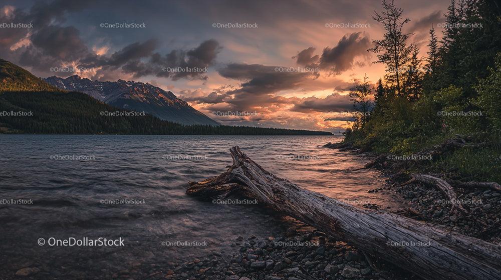 Sunset Over Lake with Mountain and Forest Silhouette