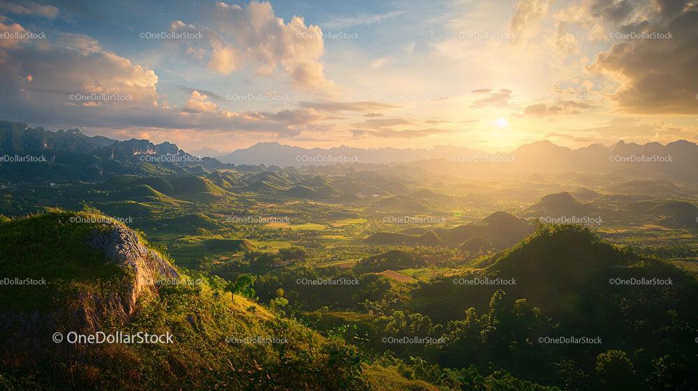 Breathtaking Sunset Over Lush Green Mountain Range