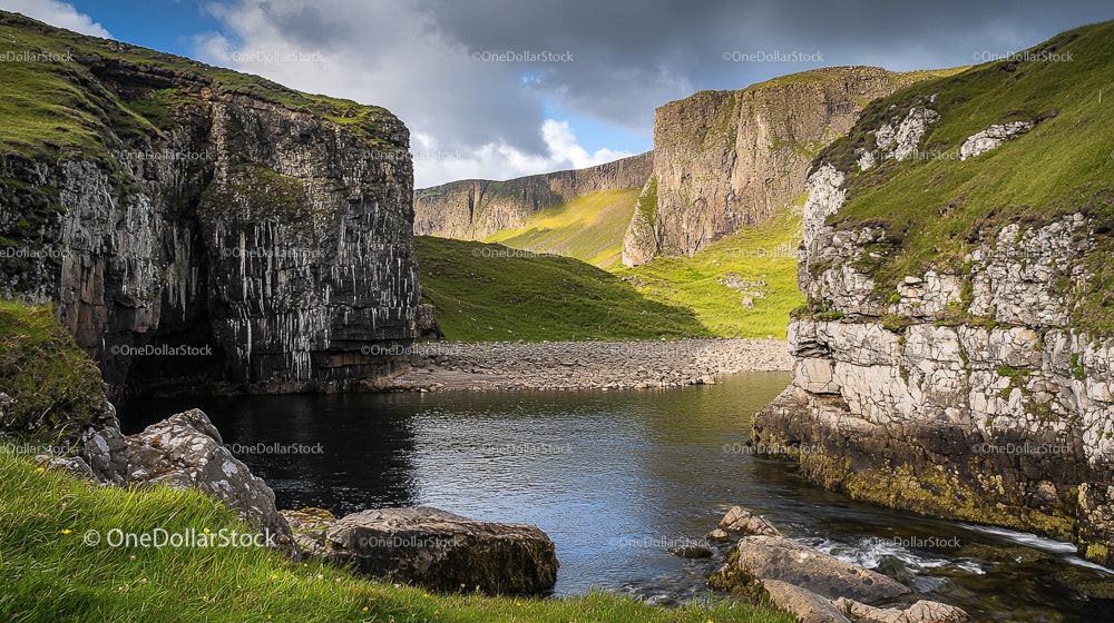 Dramatic Cliffs and Serene River in Idyllic Landscape