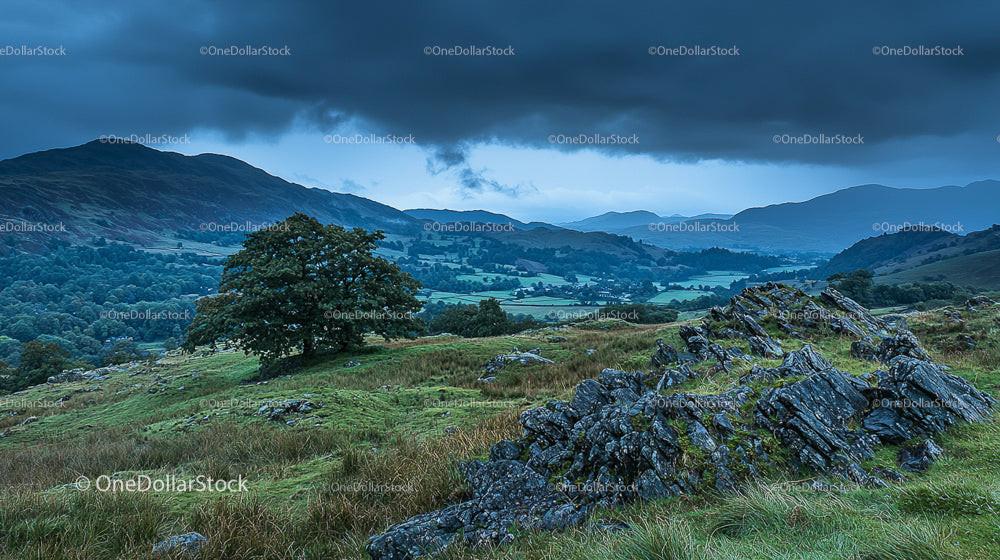 Dramatic Landscape with Stormy Sky and Rolling Hills