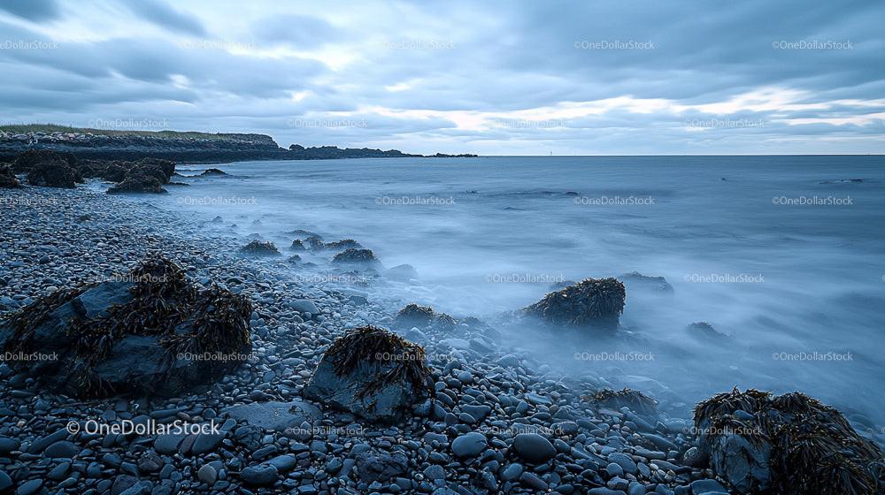 Tranquil Rocky Coastline with Misty Ocean Waves