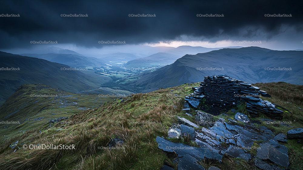 Stormy Sky Over Rugged Mountain Landscape