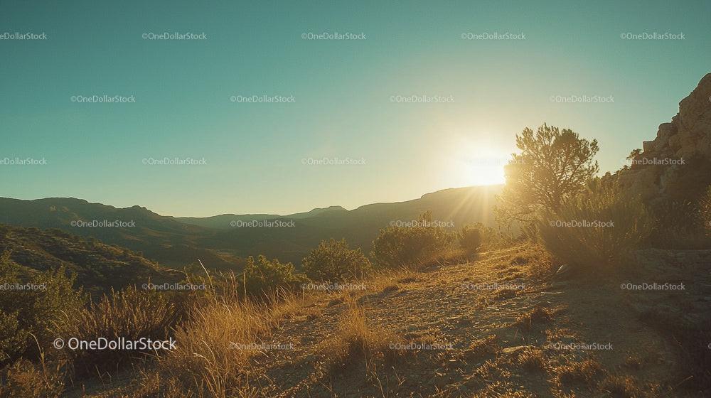 Golden Hour Over Arid Desert Landscape with Mountains