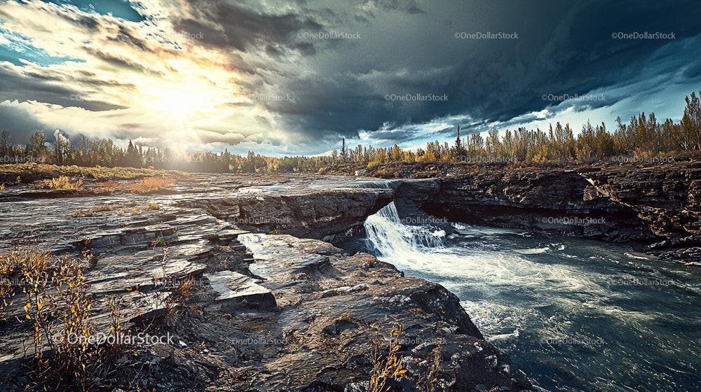 Stunning Rocky Waterfall at Sunset with Dramatic Skies