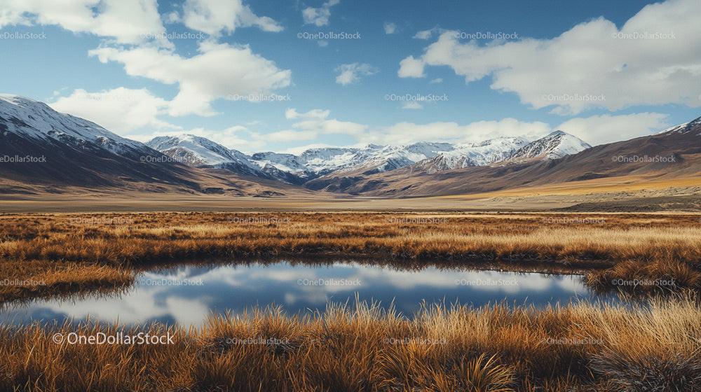 Majestic Snow-Capped Mountains and Serene Lake Reflection