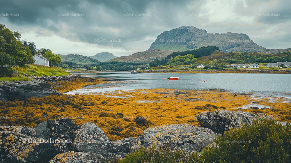 Scenic Coastal Landscape with Rocky Shore and Distant Mountains
