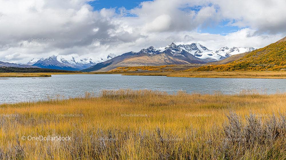 Majestic Snow-Capped Mountains with Serene Lake in Autumn