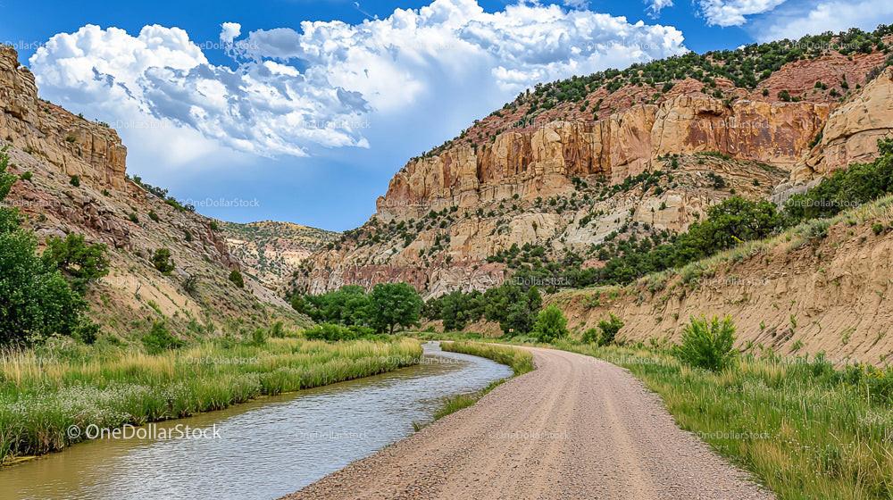 Scenic View of Rocky Canyon with River and Dirt Road