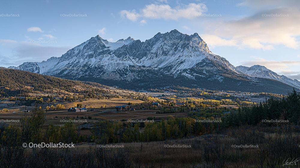 Stunning Snow-Capped Mountains and Vibrant Autumn Valley
