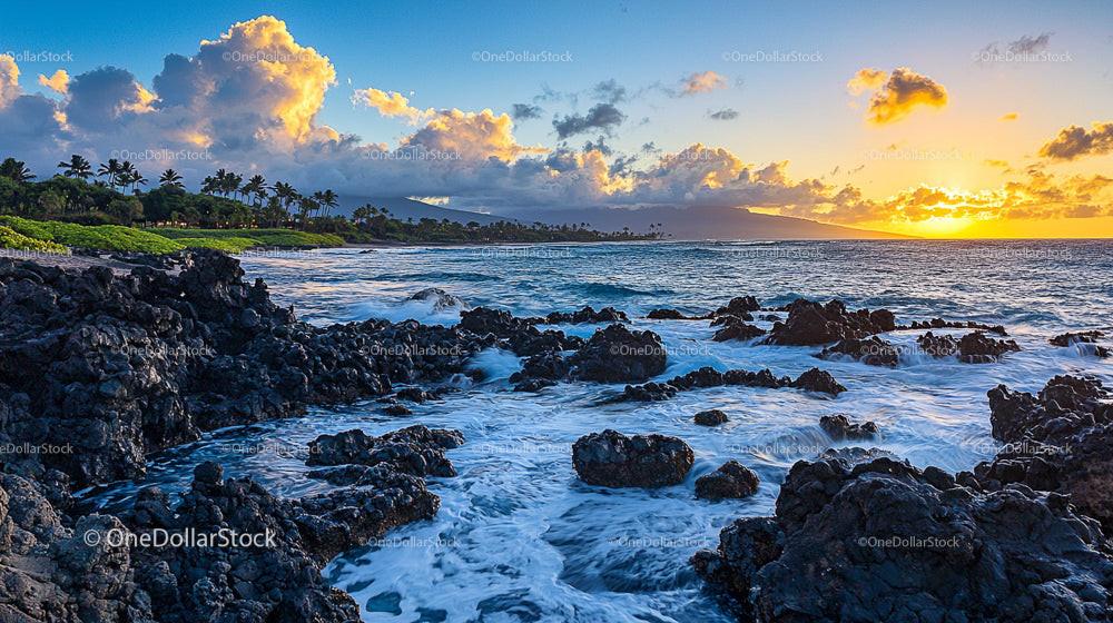 Dramatic Sunset Over Rocky Tropical Shoreline