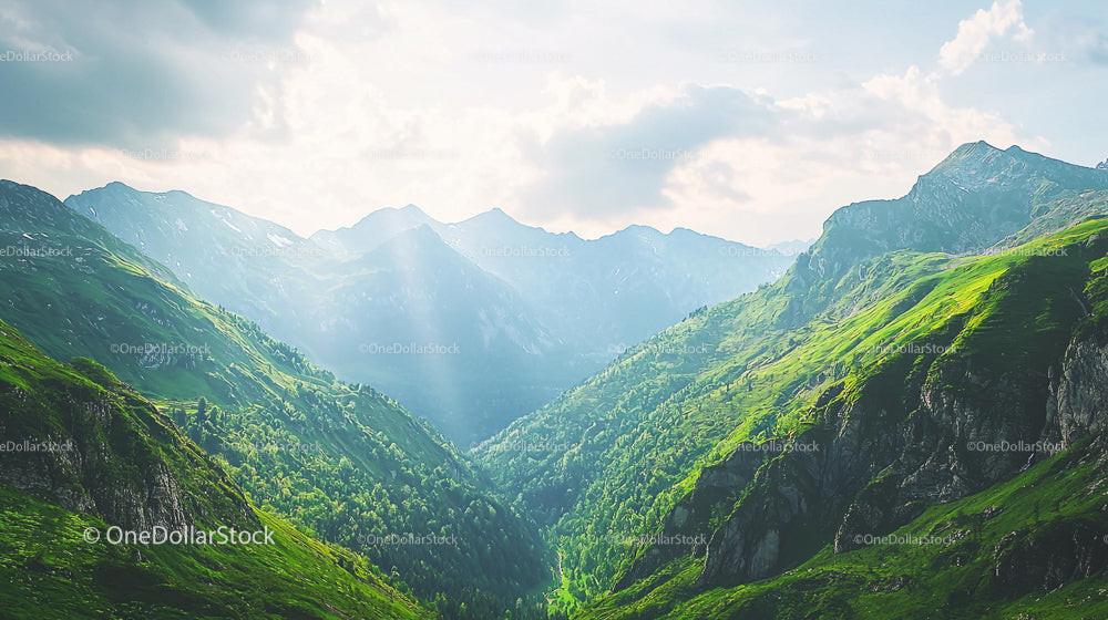 Lush Green Alpine Valley with Majestic Mountain Range