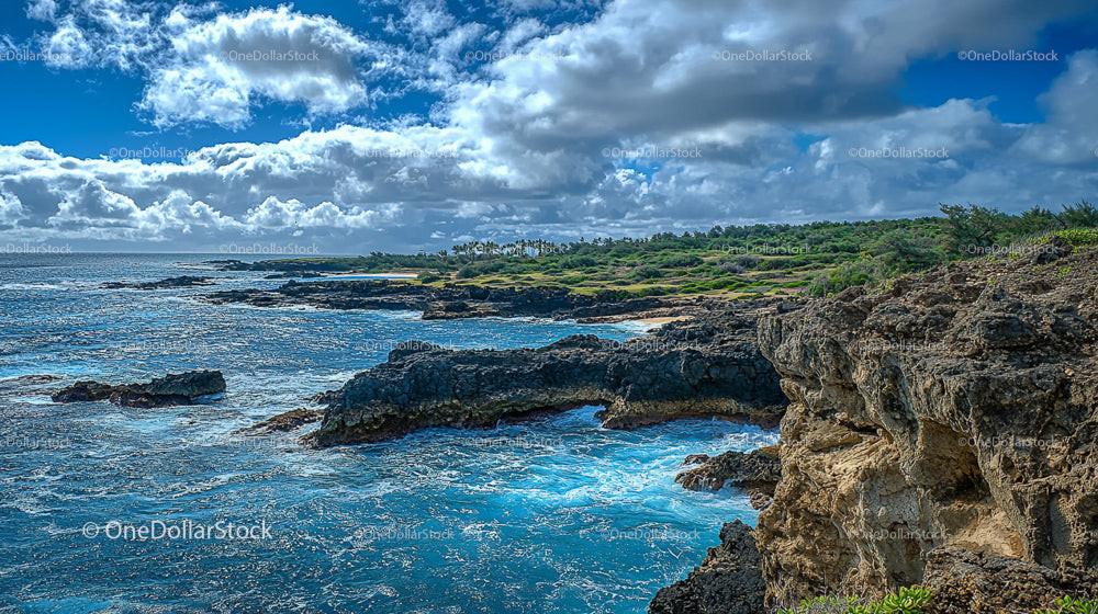 Dramatic Coastal Cliffs Under Vibrant Cloudy Sky
