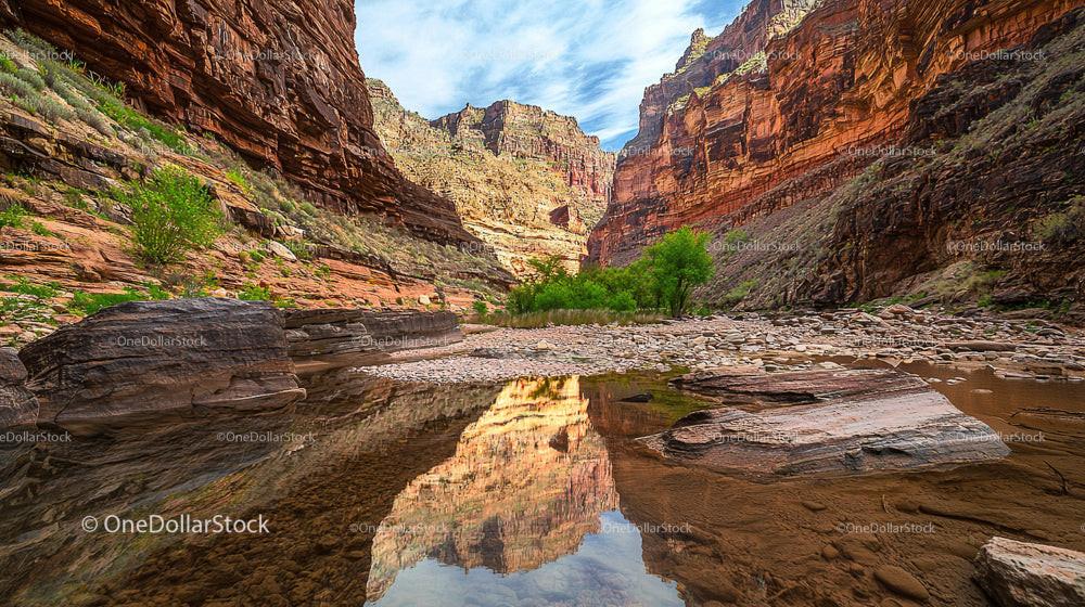 Stunning Canyon River Reflecting Red Rock Cliffs