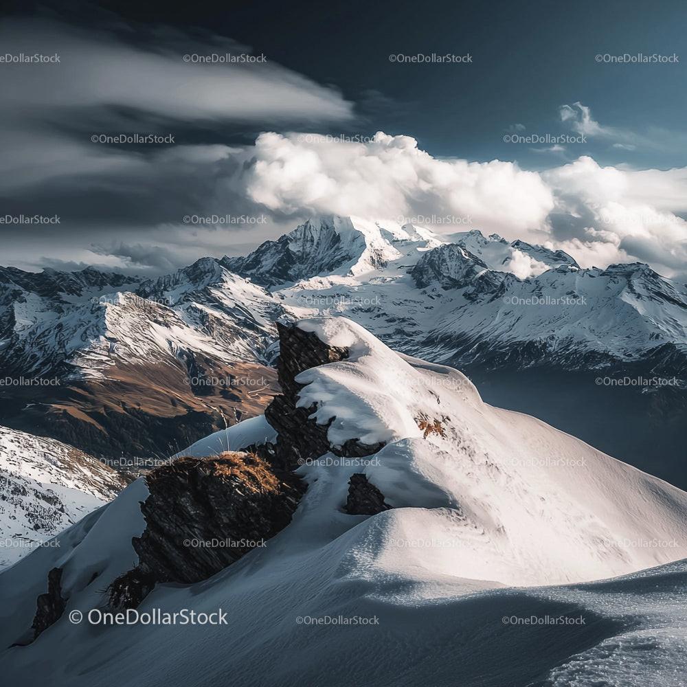 Majestic Snow-Capped Mountains Under Dramatic Skies