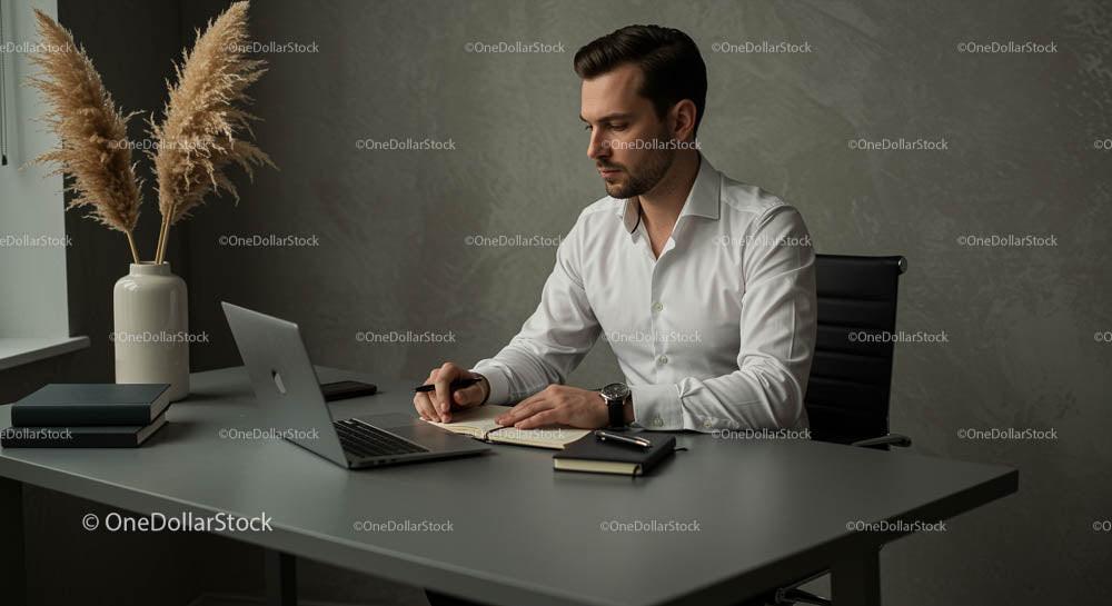Focused Businessman Working at Modern Office Desk