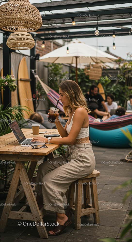 Woman Enjoying Coffee While Working in Outdoor Space
