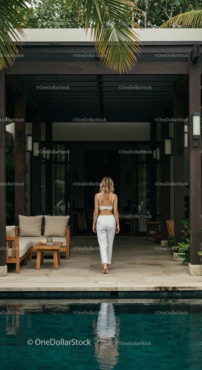 Serene Woman Walking at a Luxury Tropical Resort
