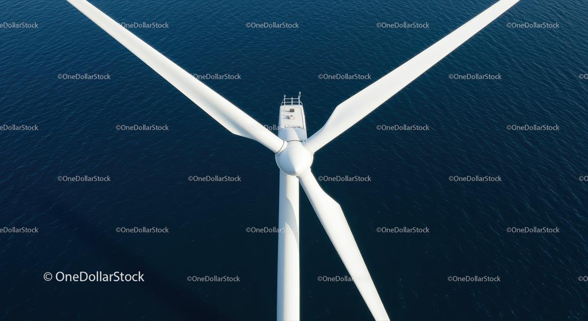 Aerial View of Offshore Wind Turbine Over Blue Ocean Waters