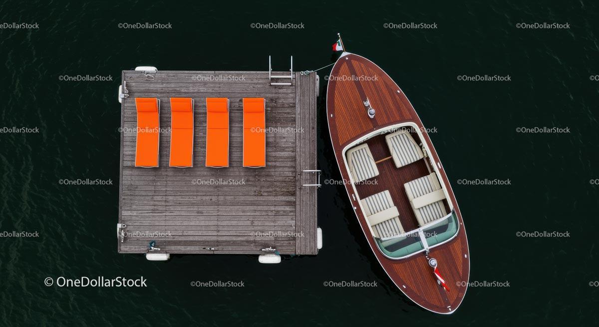 Aerial View of Luxury Yacht Beside Wooden Dock Stock Photo Bundle preview