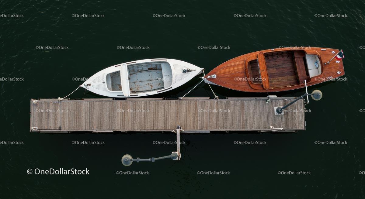 Aerial View of Two Boats Docked on a Wooden Pier