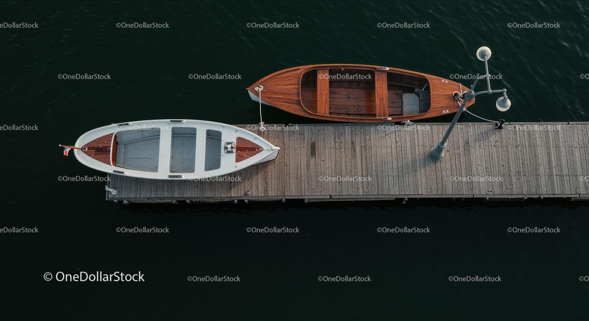 Wooden Boats Docked at Tranquil Lakeside Pier